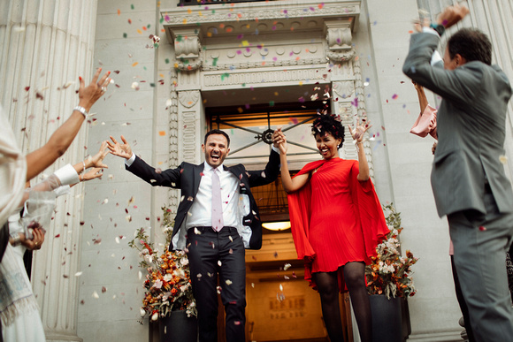 Summer wedding with red dress at The Old Marylebone Twon Hall